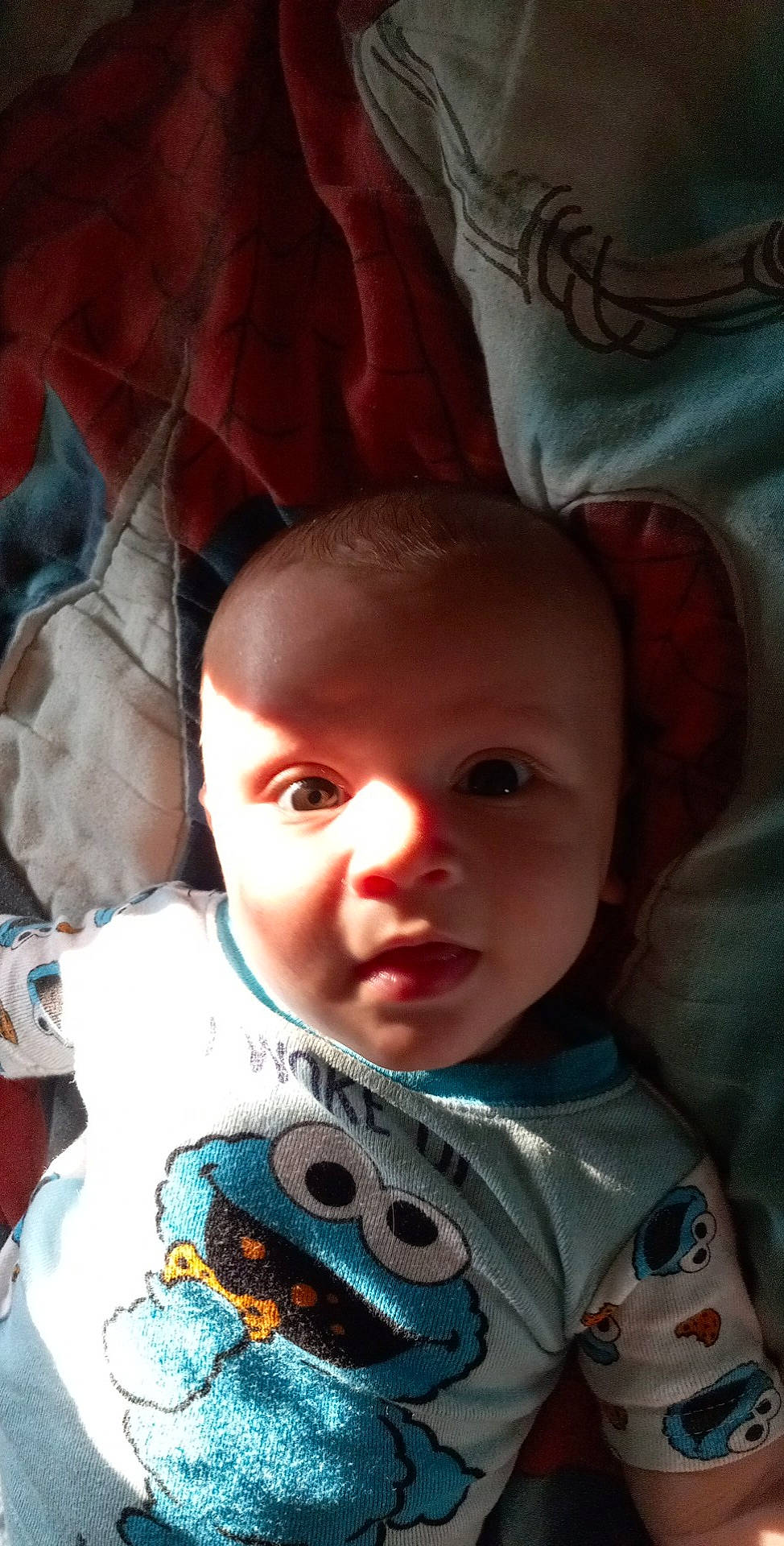 Malakai is registered to the contest to win money with this photo: baby, baby_toddler_clothing, black, cheek, chin, eye, eyebrow, face, forehead, hair, human_body, iris, lip, mouth, nose, organ, person, skin, smile, textile