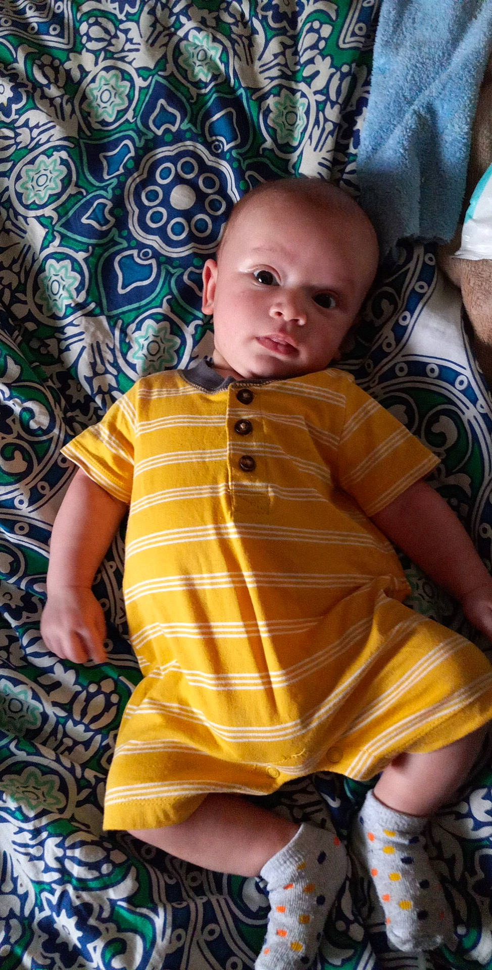 Malakai joined the competition — help win amazing prizes! baby, baby_toddler_clothing, chair, cheek, child, eye, face, head, human, linens, nose, orange, people, person, sitting, skin, sleeve, t_shirt, textile, toddler