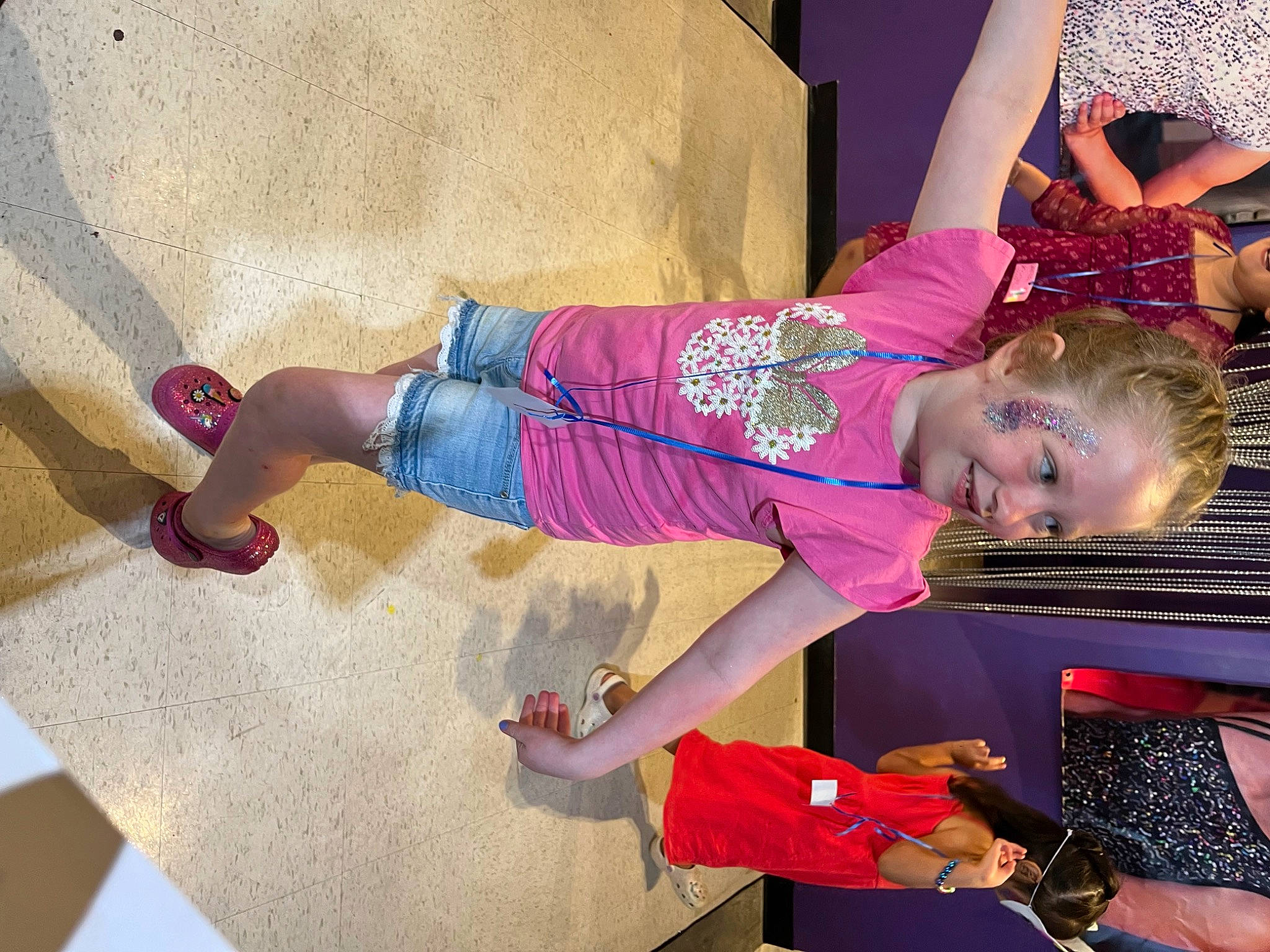 Josi is registered to the contest to win money with this photo: baby_toddler_clothing, child, fun, happy, human_leg, joy, leg, leisure, magenta, pattern, person, pink, play, purple, room, sandal, shoe, smile, thigh, toddler