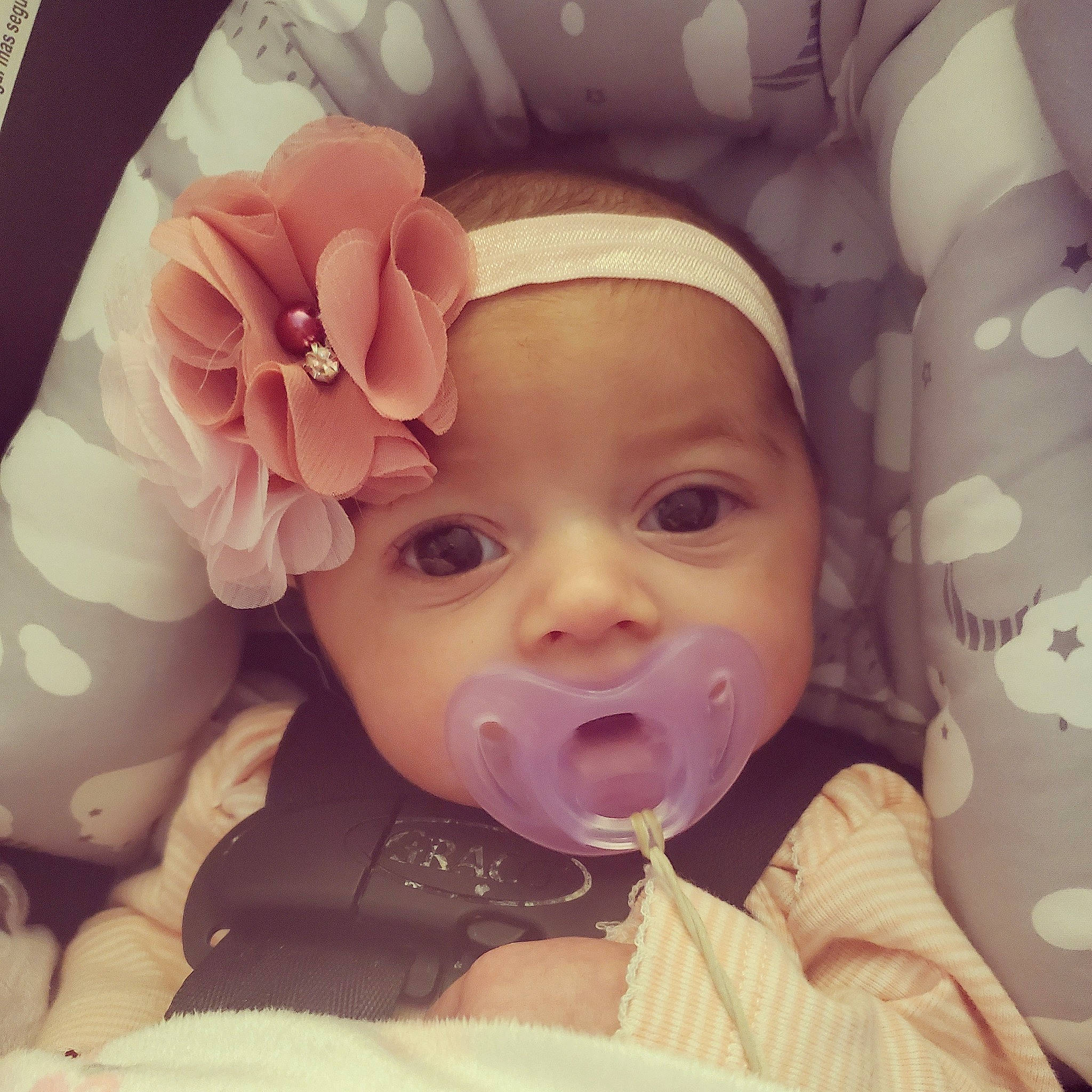Loretta is registered to the contest to win money with this photo: baby, beauty, cheek, child, chin, cool, eye, eyebrow, face, facial_expression, forehead, head, headwear, lip, mouth, nose, person, pink, selfie, skin