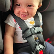 Aviah is registered to the contest to win money with this photo: baby, car_seat, child, closeup, clothing, cute, eyes, face, hands, happy, head, indoors, infant, person, safety, seat, seatbelt, smile, straps, toddler