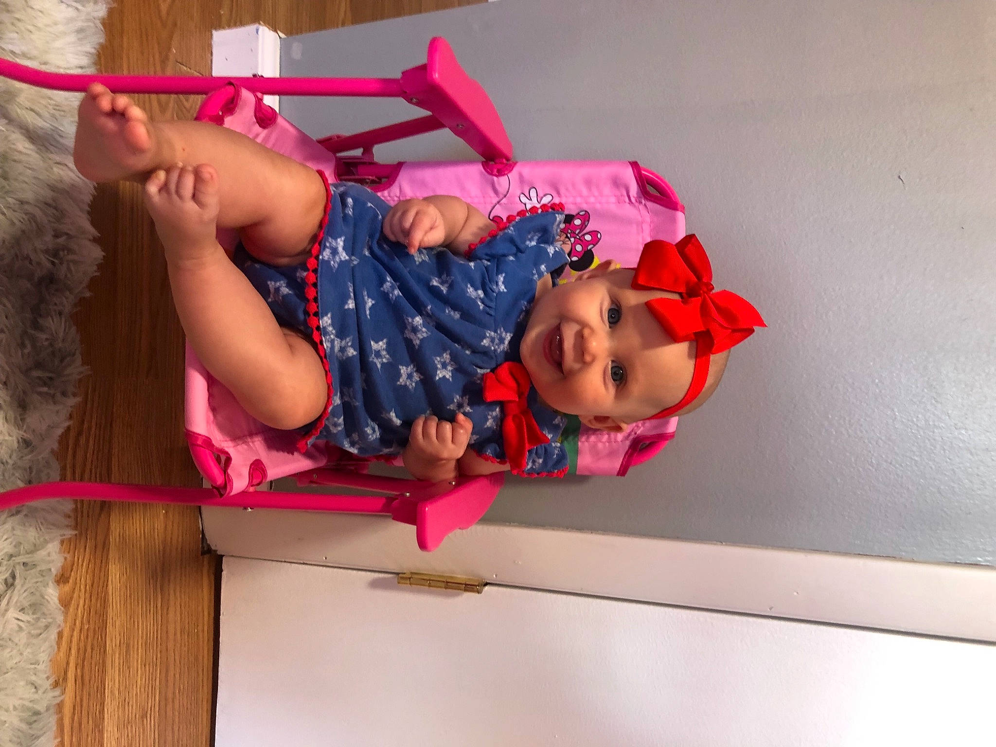 Rayleigh is registered to the contest to win money with this photo: baby_toddler_clothing, balance, child, elbow, fun, happy, headwear, human_leg, joy, knee, leisure, magenta, pattern, person, pink, room, sandal, sock, thigh, toddler