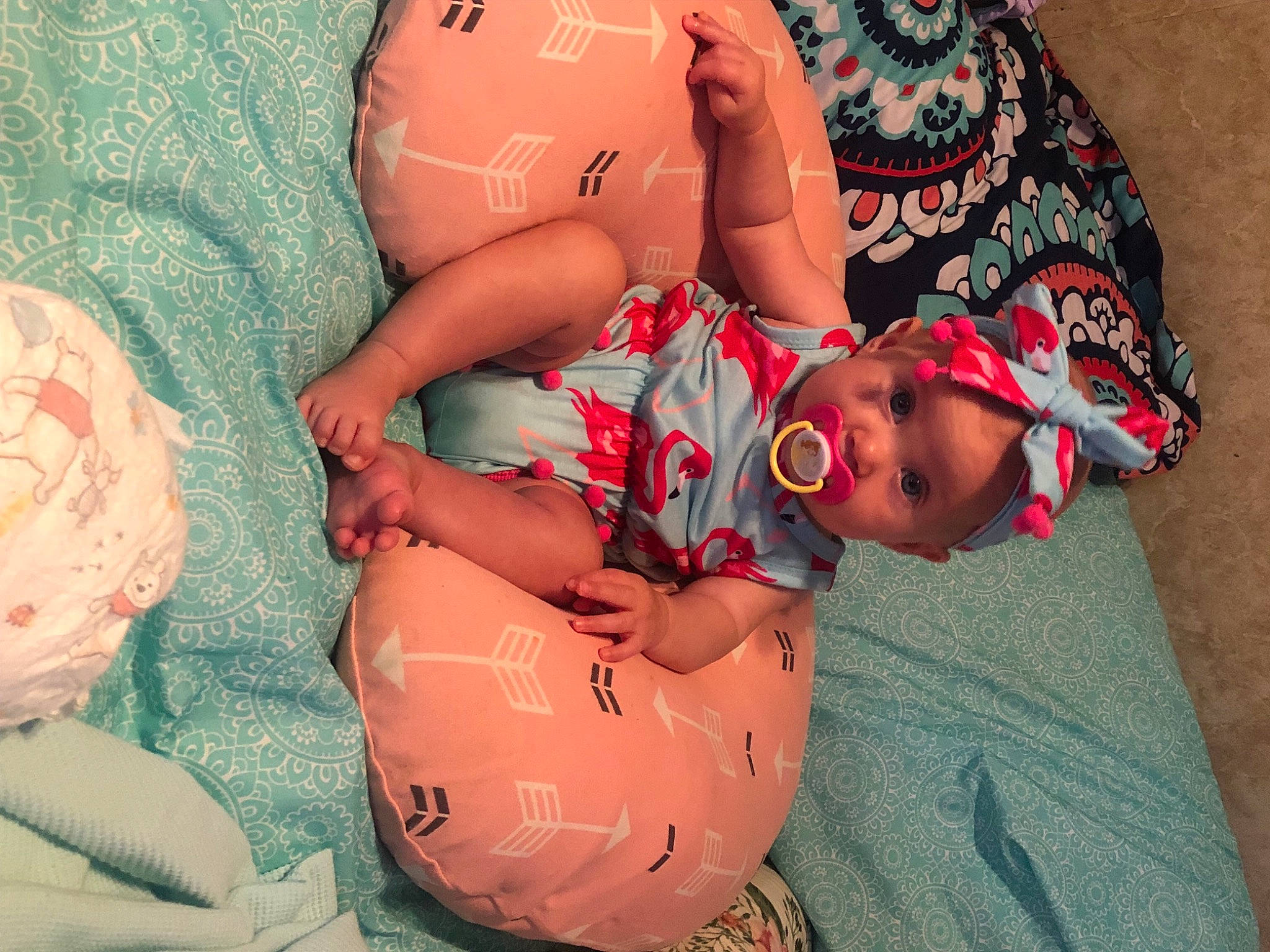 Rayleigh is registered to the contest to win money with this photo: abdomen, baby, comfort, face, facial_expression, finger, glasses, hand, head, human_body, interaction, joint, mouth, muscle, orange, person, pink, skin, stomach, thigh