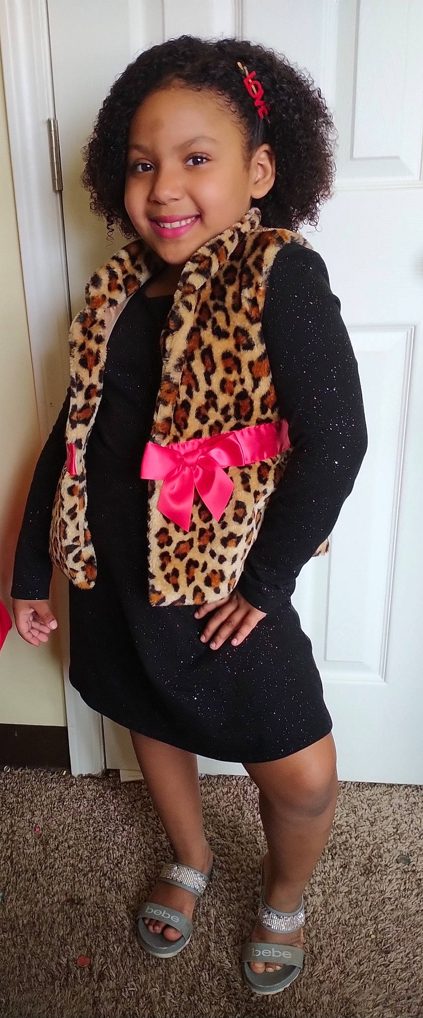 Imani is registered to the contest to win money with this photo: arm, black, collar, human_body, jacket, joint, joy, lip, neck, outerwear, person, pink, shoulder, sleeve, smile, stole, street_fashion, tartan, textile, thigh