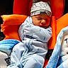 Severus is registered to the contest to win money with this photo: newborn, baby, sleeping, onesie, hat, blanket, orange_seat, cozy, infant, child, cute, resting, peaceful, soft, warm, indoor, portrait, comfort, baby_clothes, sleep