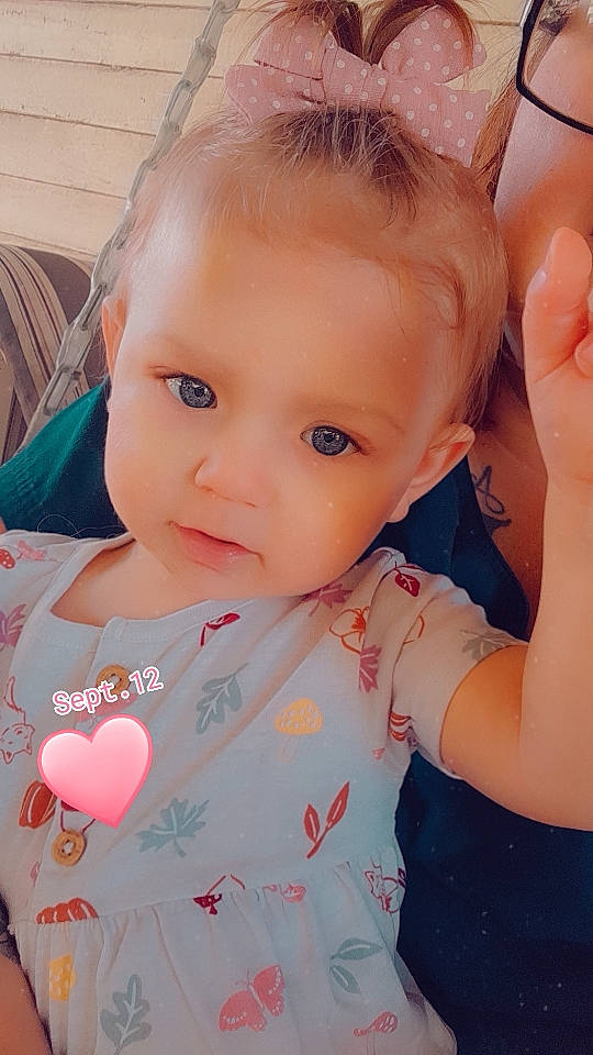 Ralynn is registered to the contest to win money with this photo: arm, baby_toddler_clothing, cheek, chin, ear, eye, eyebrow, eyelash, face, facial_expression, hair, hand, head, lip, mouth, neck, nose, organ, person, shoulder