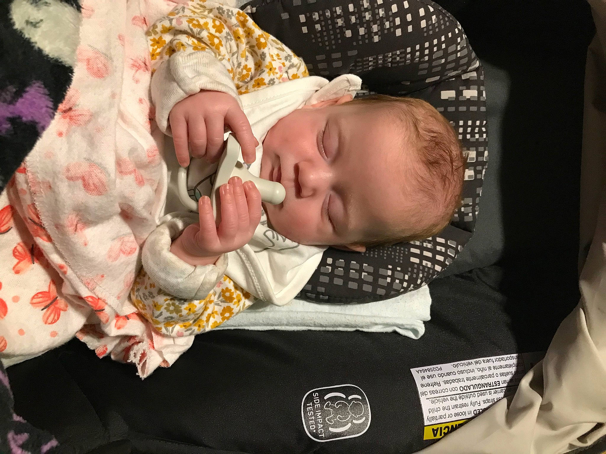 Ralynn is registered to the contest to win money with this photo: baby, baby_carriage, baby_products, baby_sleeping, baby_toddler_clothing, bedtime, cheek, child, comfort, ear, eyelash, human_body, linens, nail, pattern, person, product, room, sitting, skin