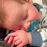 Pierson joined the competition — help win amazing prizes! baby, infant, sleeping, pacifier, hand, blanket, onesie, close_up, cozy, eyelashes, face, ear, nursery, baby_swing, soft_texture, newborn, furniture, calm, bedroom, blanket_texture