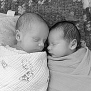 Ella is registered to the contest to win money with this photo: baby, newborn, twins, sleeping, swaddle, blanket, crochet_blanket, pacifier, black_and_white, cute, peaceful, portrait, infant, face, close_up, napping, soft_texture, head, bedding, sleepwear