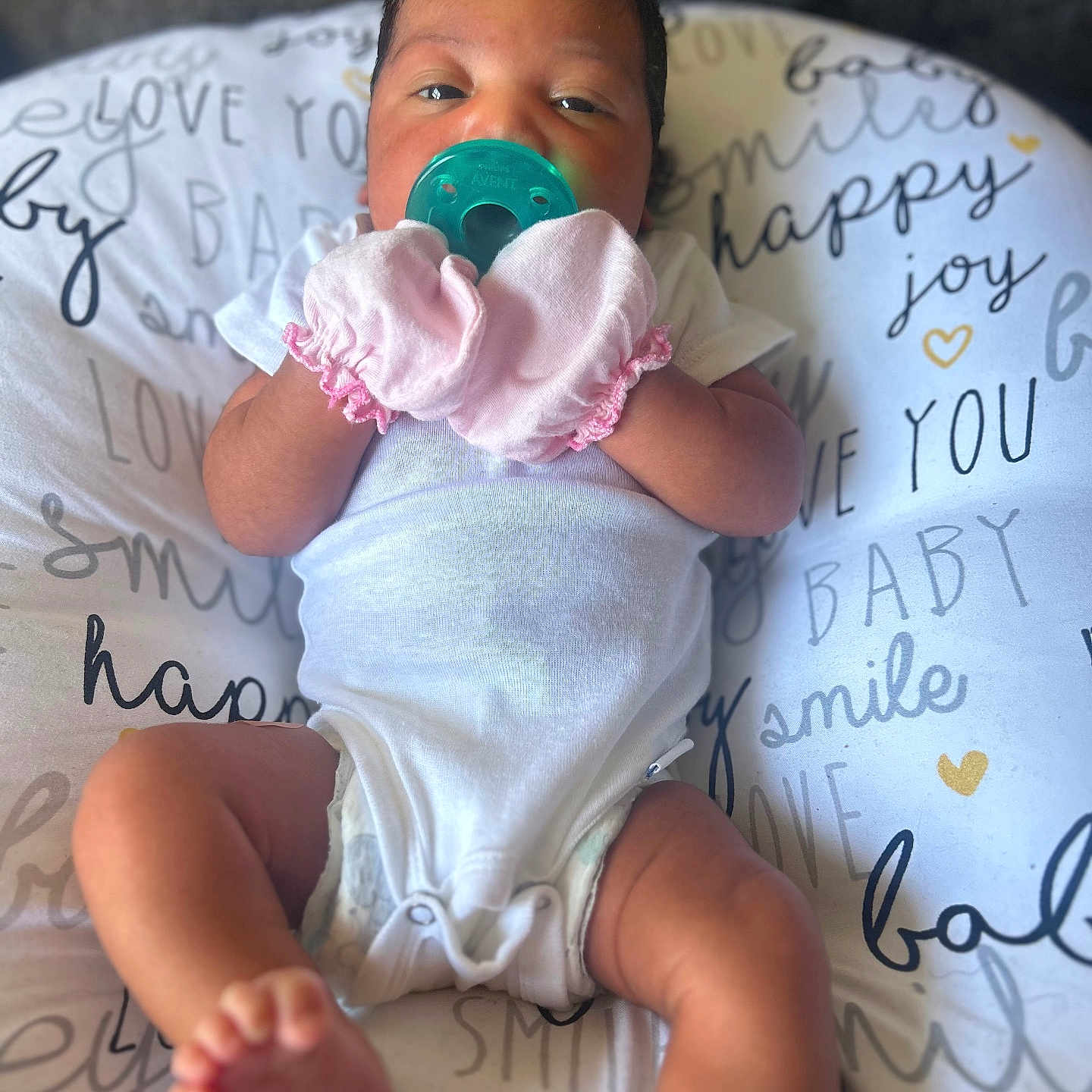 Essénce Marie joined the competition — help win amazing prizes! baby, bed, bodypart, clothing, cushion, diaper, face, finger, furniture, glove, hand, head, homedecor, newborn, person, photography, portrait, sitting, t_shirt, text