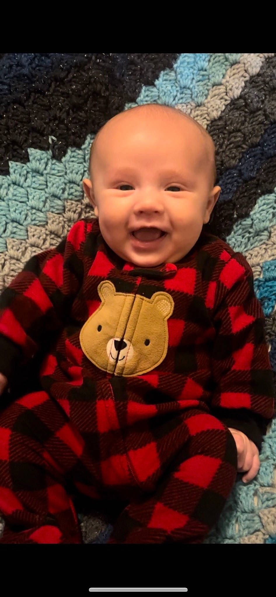 Braelon is registered to the contest to win money with this photo: baby_toddler_clothing, cheek, chin, dress, eye, face, happy, nose, orange, outerwear, person, plaid, plant, red, skin, sleeve, smile, standing, tartan, toddler