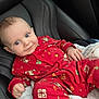 baby, blanket, bodypart, car, clothing, cushion, dress, face, happy, head, homedecor, pajamas, pants, person, photography, portrait, sitting, smile, transportation, vehicle