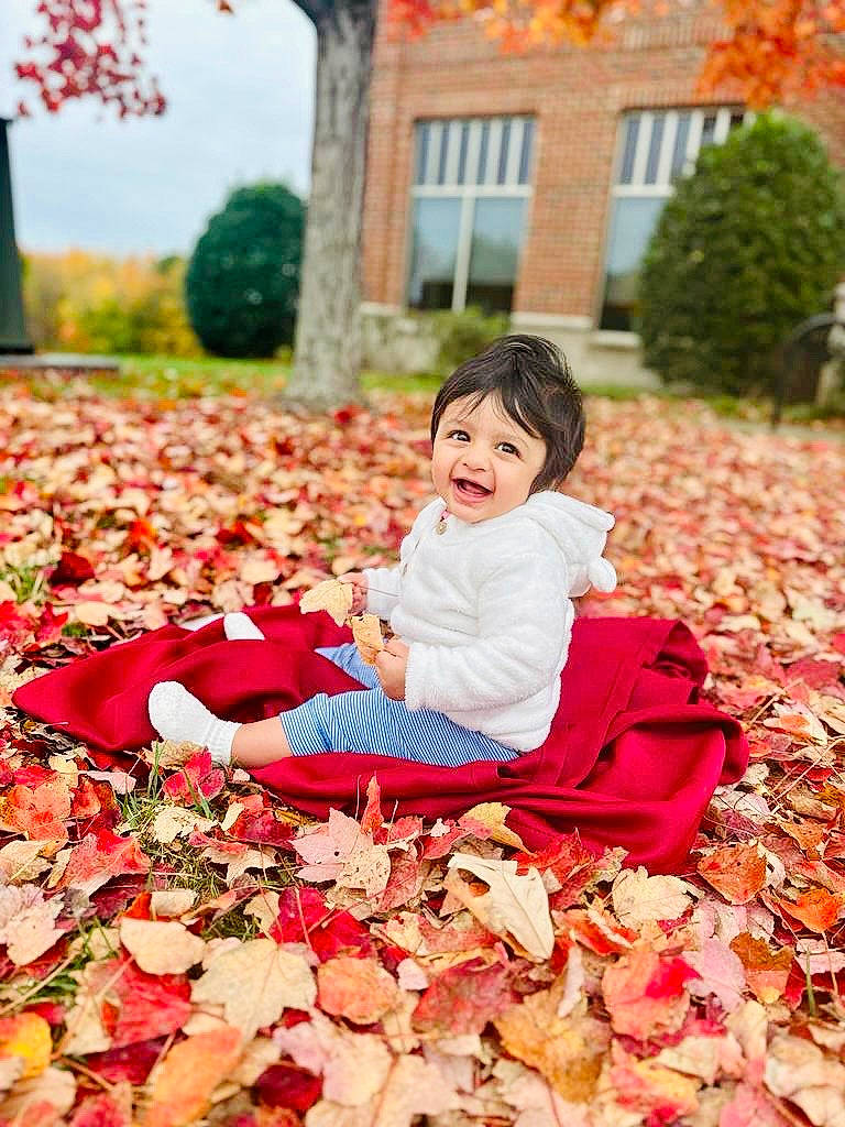 Shanaya is registered to the contest to win money with this photo: beauty, botany, deciduous, grass, happy, leisure, nature, orange, people, people_in_nature, person, photograph, plant, playing_with_kids, red, smile, tints_and_shades, toddler, tree, window