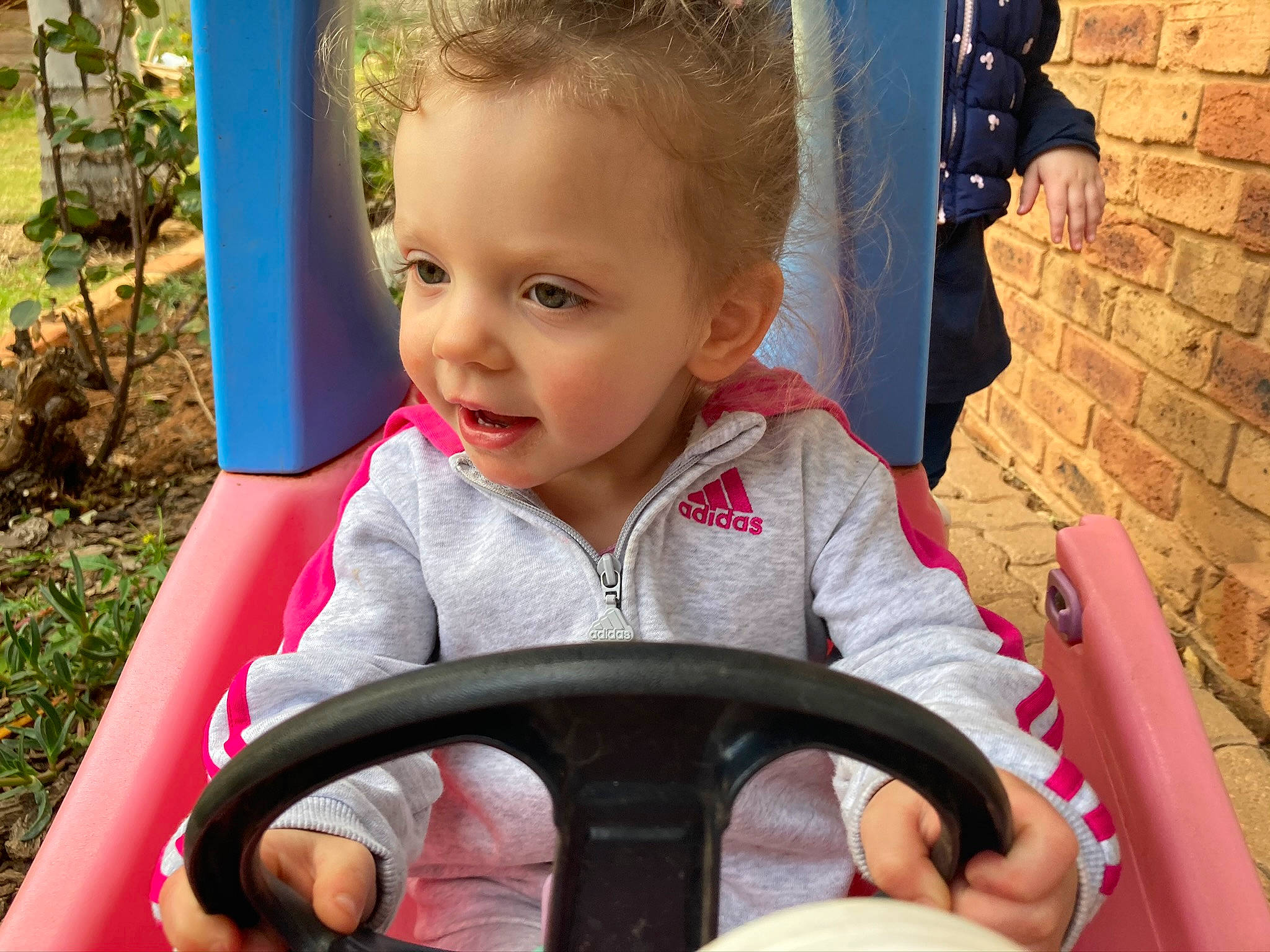 Halo joined the competition — help win amazing prizes! baby, eye, facial_expression, fun, grass, hair, hairstyle, happy, head, human, iris, leisure, light, mouth, person, photograph, plant, product, skin, steering_wheel