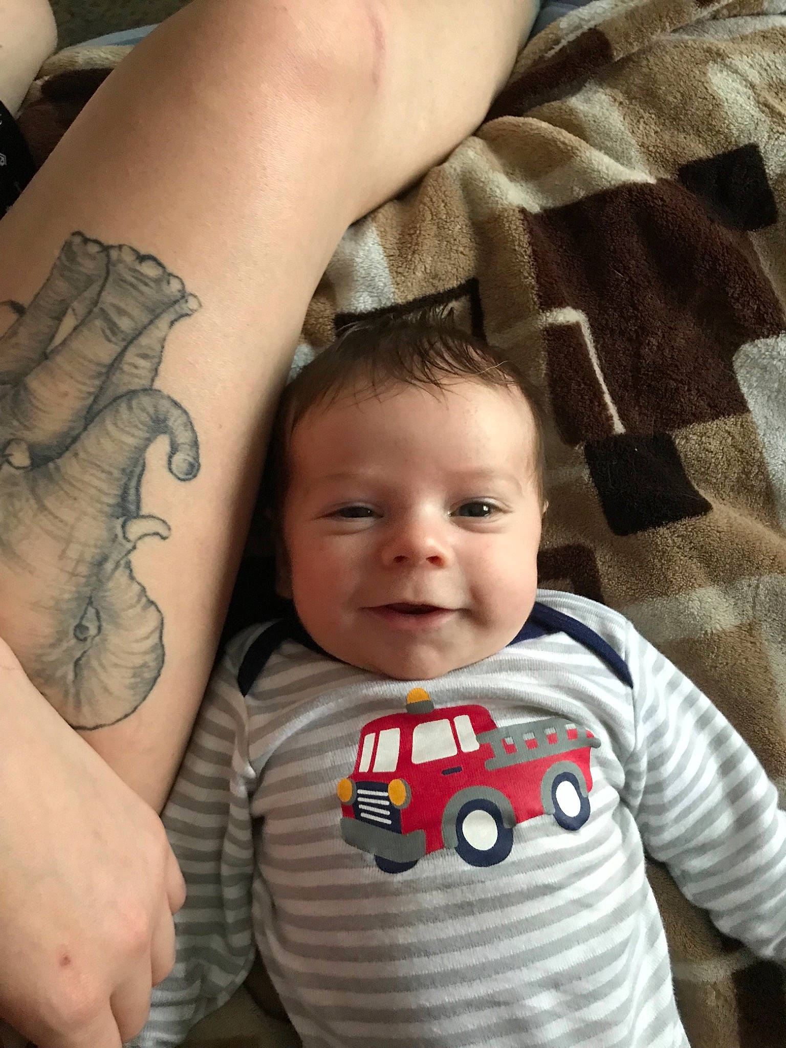Braiden is registered to the contest to win money with this photo: arm, cheek, child, cool, finger, forehead, hand, infant, joint, leg, neck, nose, person, product, skin, tattoo, toddler