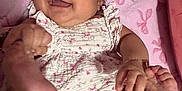 Marilu joined the competition — help win amazing prizes! baby, smiling, infant, pink_blanket, cute, happy, clothing, patterned_outfit, barefoot, lying_down, playful, child, indoors, bracelet, soft_texture, closeup, portrait, hands, feet, adorable