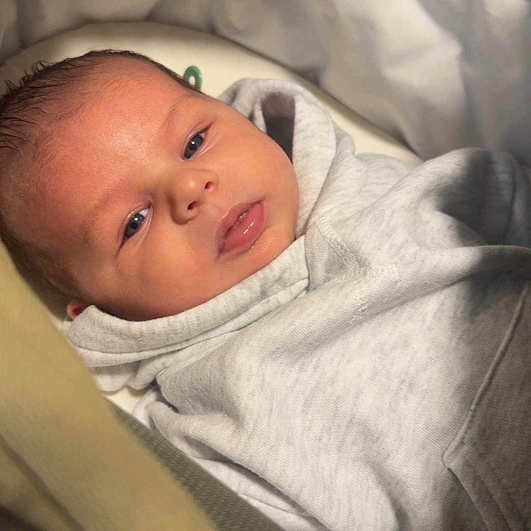 Luca joined the competition — help win amazing prizes! baby, bed, blanket, clothing, cradle, crib, cushion, face, furniture, happy, head, homedecor, infantbed, knitwear, newborn, person, photography, portrait, sleeping, smile