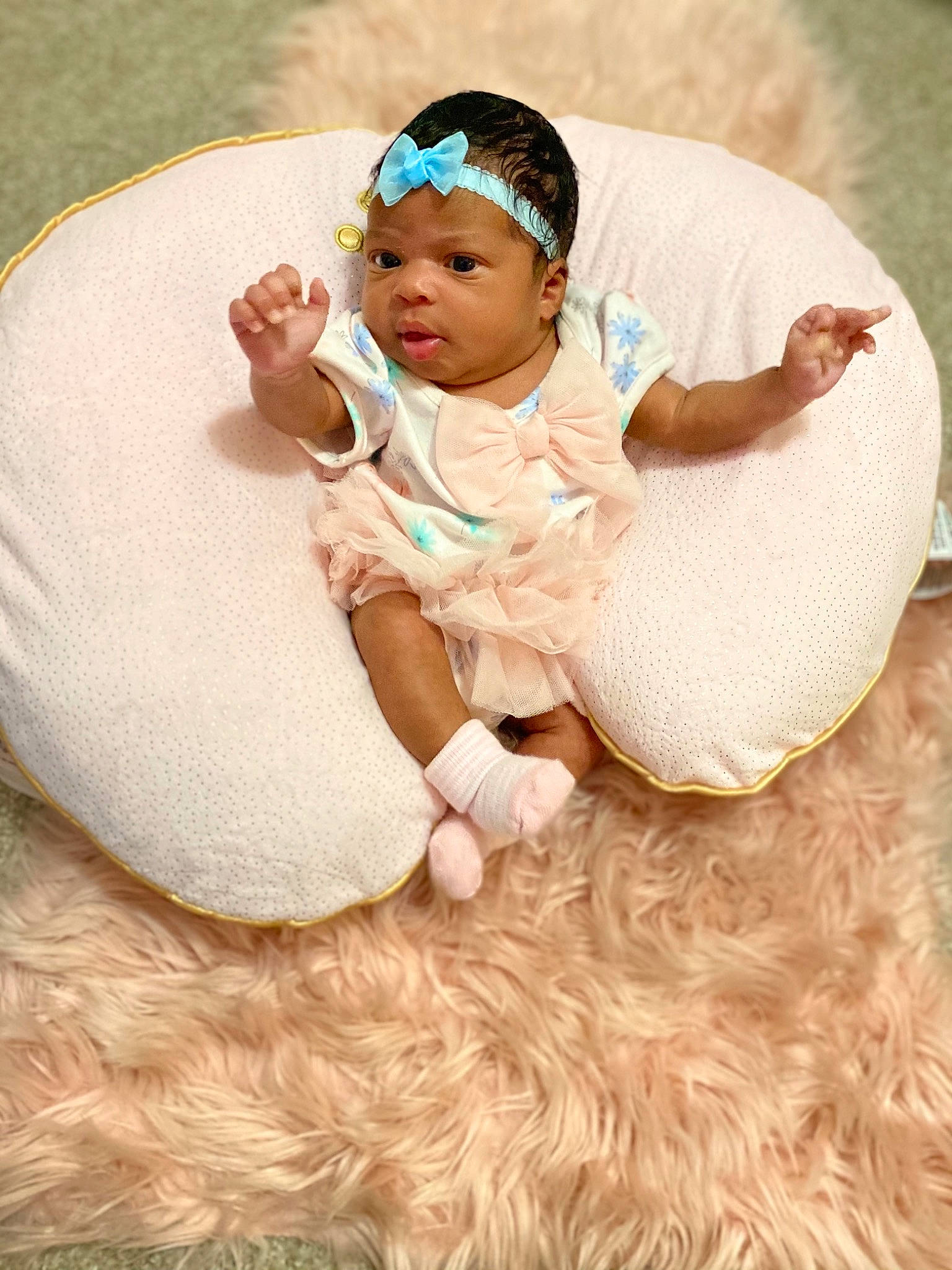 Jaziah is registered to the contest to win money with this photo: baby, beauty, child, comfort, costume, dress, family, fur, hair_accessory, happy, headgear, linens, person, photography, pink, product, skin, smile, textile, toddler