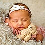 Evelyn is registered to the contest to win money with this photo: adorable, baby, blanket, closeup, cozy, cute, flower, fuzzy, hand, headband, infant, newborn, peaceful, pink_clothing, portrait, resting, sleeping, soft_texture, stuffed_animal, teddy_bear