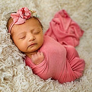 Evelyn is registered to the contest to win money with this photo: baby, babywear, blanket, child, closeup, cozy, cute, flower, headband, homedecor, infant, newborn, peaceful, pink_blanket, portrait, resting, sleeping, soft_texture, warm, wrapped