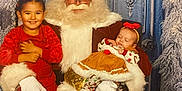 Nyla joined the competition — help win amazing prizes! santa_claus, child, baby, holiday, christmas, red_clothing, smiling, sleeping, festive, costume, beard, glasses, chair, winter, decorative_door, frosted_trees, boots, headband, indoor, family