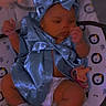 baby, infant, child, portrait, blue_outfit, bow, satin, baby_seat, pacifier, diaper, socks, seated, indoors, nursery, blanket, lion_pattern, face, hands, legs, photography