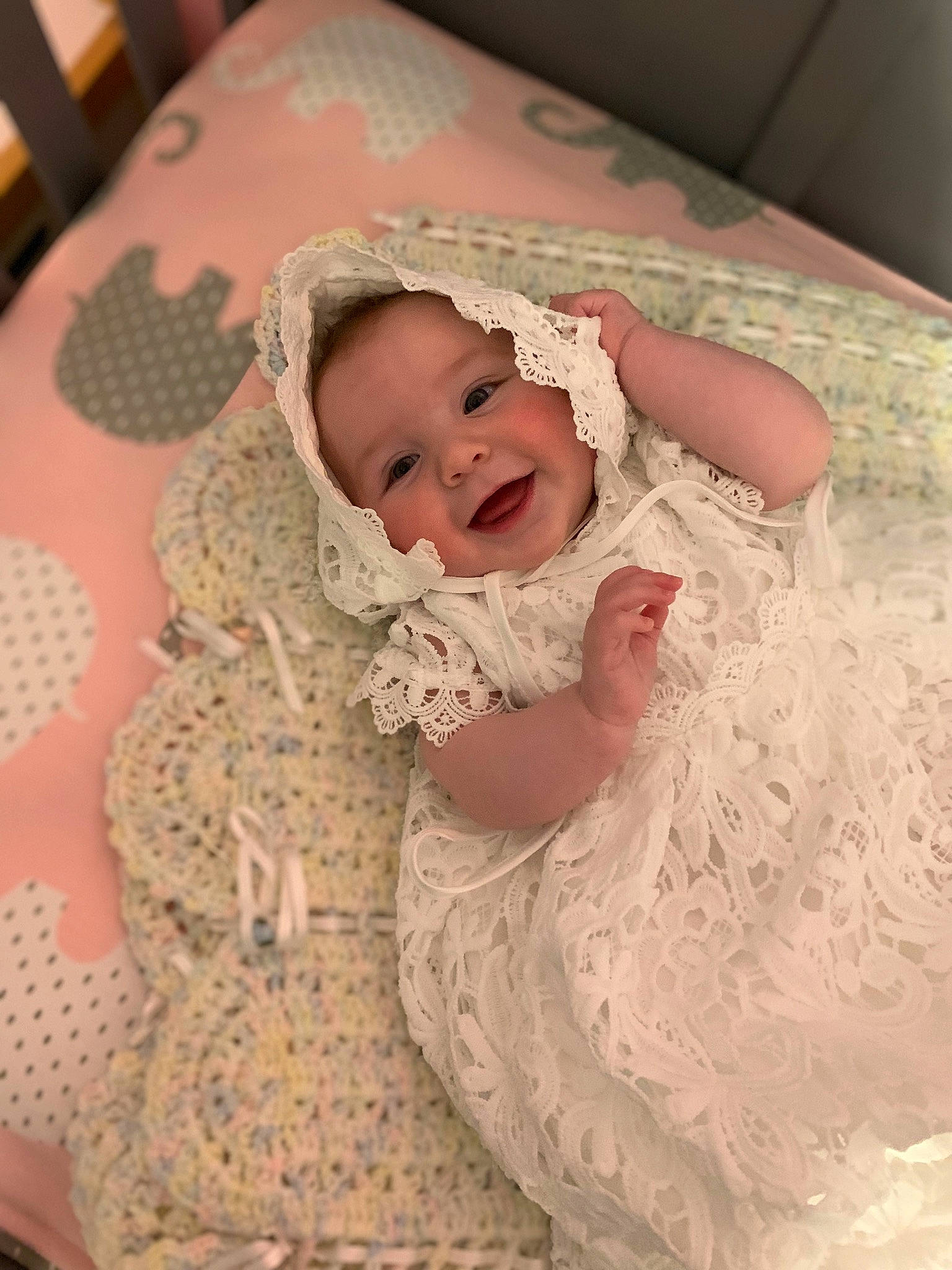 Gracelyn joined the competition — help win amazing prizes! baby, baby_toddler_clothing, bedding, cheek, child, comfort, embellishment, happy, linens, mammal, pattern, peach, person, pink, room, skin, sleeve, smile, textile, toddler