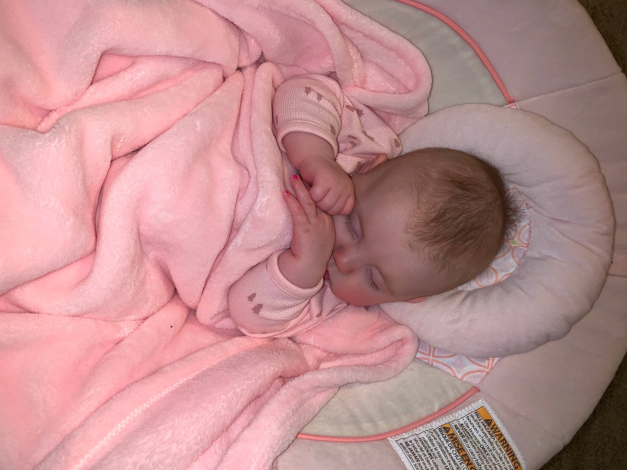 Gracelyn is registered to the contest to win money with this photo: baby, baby_products, baby_safety, baby_sleeping, baby_toddler_clothing, bedtime, child, comfort, linens, nap, pattern, peach, person, pink, product, room, skin, sleep, textile, thumb