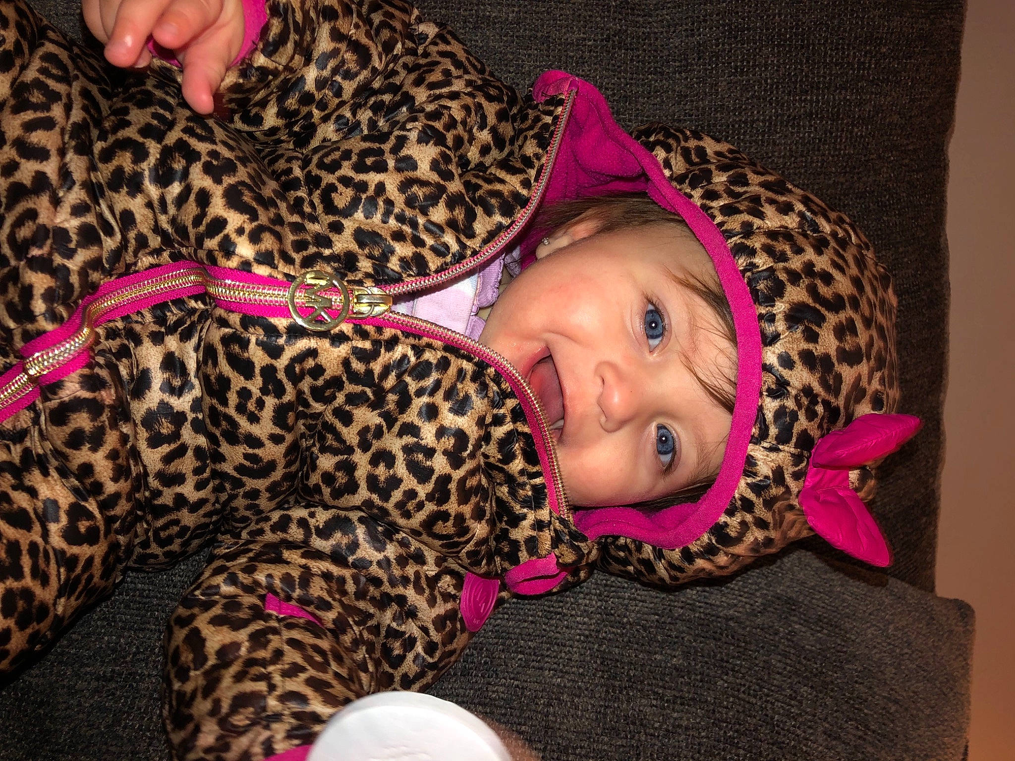 Addisyn is registered to the contest to win money with this photo: baby, baby_toddler_clothing, cap, child, costume_hat, eye, fashion_accessory, felidae, fun, fur, hat, head, headgear, headwear, magenta, pattern, person, pink, room, skin