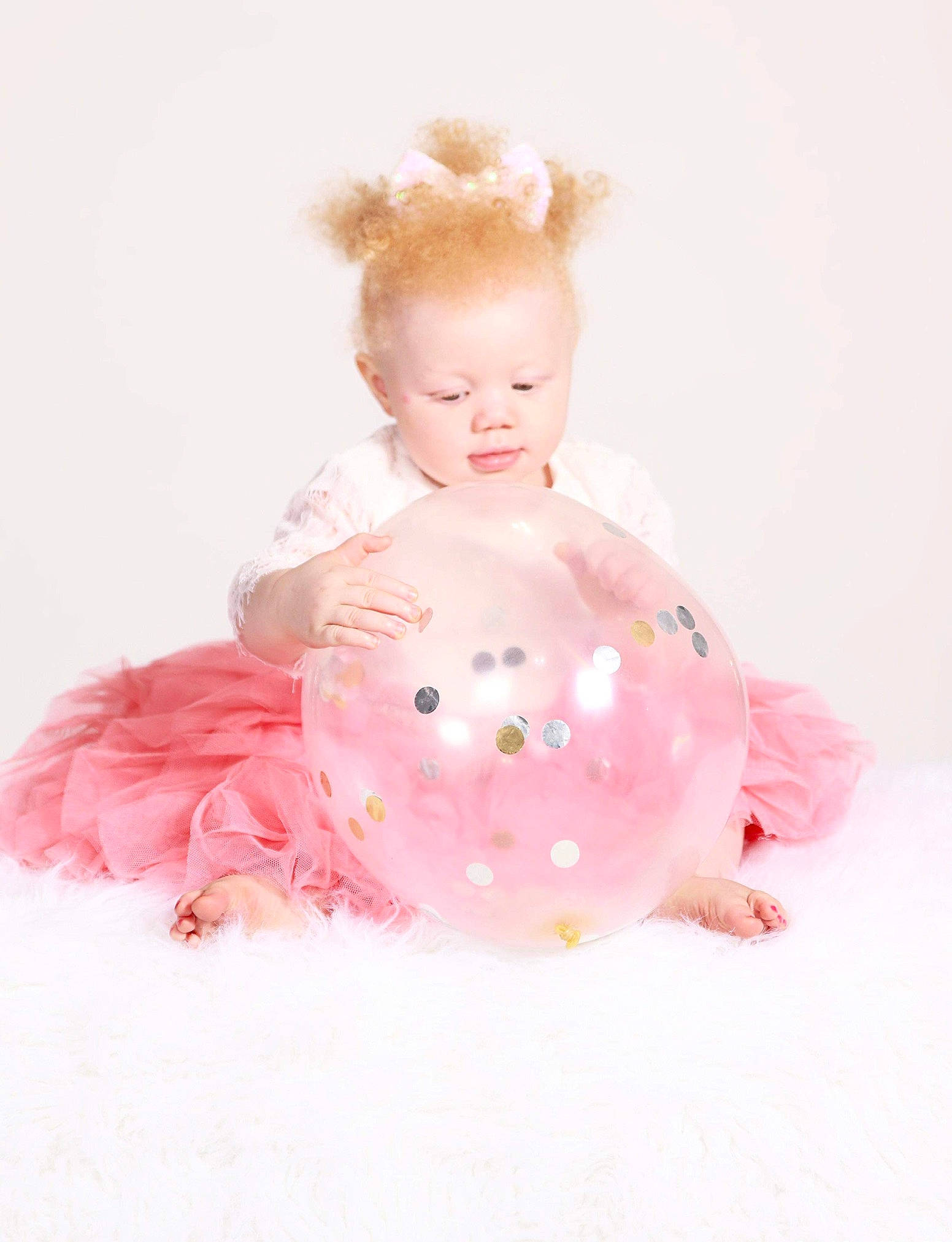 Kaniya is registered to the contest to win money with this photo: abdomen, arm, baby, baby_products, baby_toddler_clothing, cheek, chest, child, dress, embellishment, fashion_accessory, hairstyle, happy, jewellery, magenta, peach, person, pink, sleeve, toddler