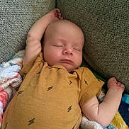 Waylen joined the competition — help win amazing prizes! baby, infant, sleeping, portrait, face, closed_eyes, peaceful, couch, blanket, fuzzy_blanket, mustard_clothing, onesie, arms, hand, indoor, cozy, resting, closeup, soft_lighting, child