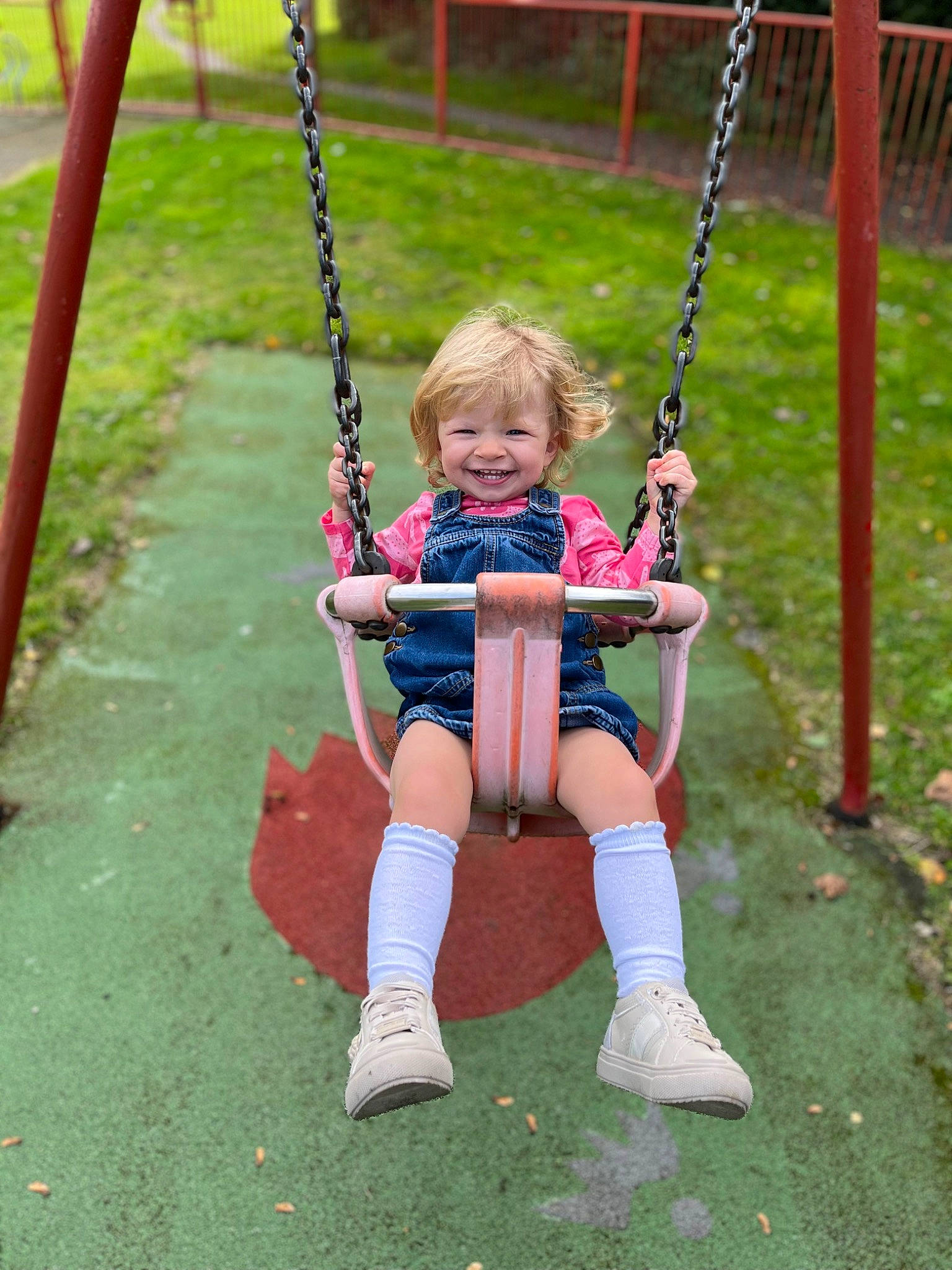 Lyla-rose joined the competition — help win amazing prizes! baby, city, eye, fun, grass, hand, happy, human_body, joy, leisure, outdoor_play_equipment, person, photograph, plant, playground, recreation, shorts, smile, swing, toddler