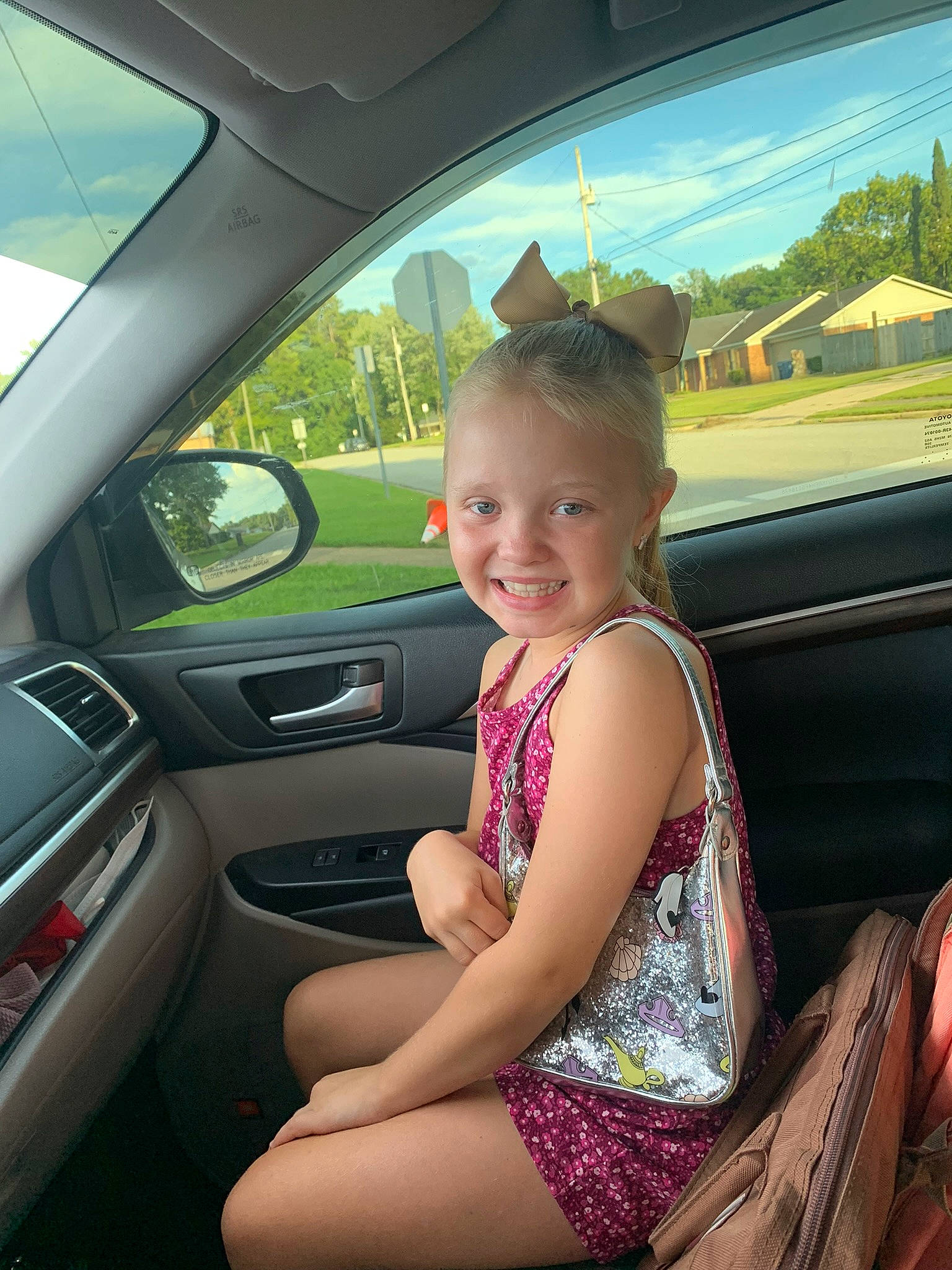 Baylee is registered to the contest to win money with this photo: auto_part, automotive_design, automotive_exterior, automotive_mirror, automotive_window_part, beauty, car, car_seat, car_seat_cover, joy, mode_of_transport, motor_vehicle, person, personal_luxury_car, rear_view_mirror, smile, steering_part, steering_wheel, vehicle, vehicle_door