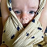 Colson joined the competition — help win amazing prizes! baby, infant, face, eyes, blanket, swaddle, cloth, pattern, person, skin, head, cute, wrapped, closeup, indoors, child, newborn, expression, comfort, holding