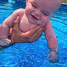 Colson is registered to the contest to win money with this photo: baby, child, pool, water, smiling, happy, outdoor, sunlight, hand, skin, summer, blue, fence, nature, person, swimming, water_surface, head, face, playful