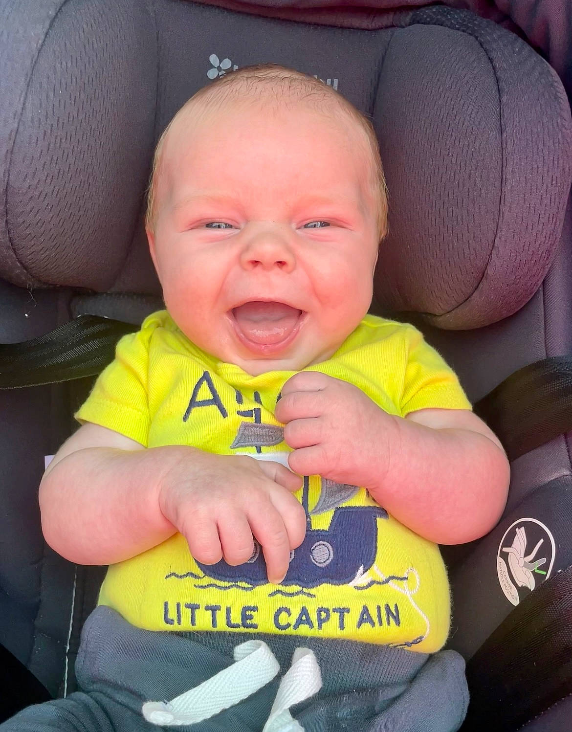 William is registered to the contest to win money with this photo: baby, baby_products, baby_safety, baby_toddler_clothing, cheek, child, comfort, eye, face, facial_expression, finger, happy, head, mouth, person, product, sitting, skin, sleeve, smile