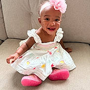 Miana joined the competition — help win amazing prizes! accessory, apparel, baby, child, couch, cute, dress, face, fashion, flower, happy, headband, indoors, infant, person, pink_shoes, portrait, seated, skin, smiling