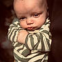 Elias Martin joined the competition — help win amazing prizes! baby, child, infant, face, expression, pout, striped_clothing, onesie, cute, portrait, young, skin, head, hand, closeup, person, indoor, soft_light, serious, human