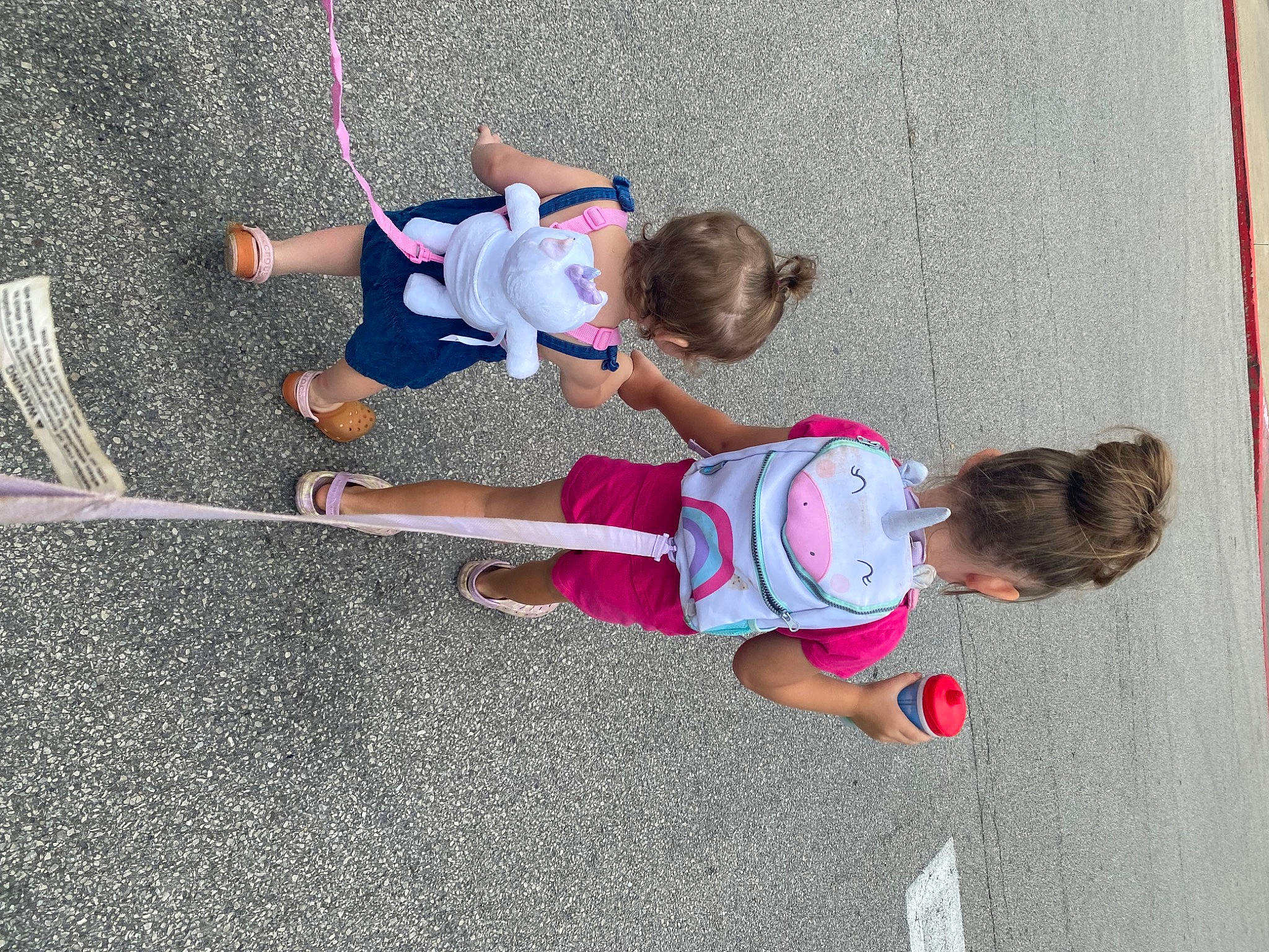 Jazmyn is registered to the contest to win money with this photo: asphalt, child, city, concrete, fun, knee, leg, leisure, person, physical_fitness, play, recreation, rope, shorts, sidewalk, sneakers, sports, t_shirt, thigh, toddler
