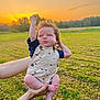 Greyson is registered to the contest to win money with this photo: baby, child, infant, outdoor, sunset, field, grass, hands, sky, nature, person, clothing, overalls, expression, portrait, summer, cute, young, happy, sunlight