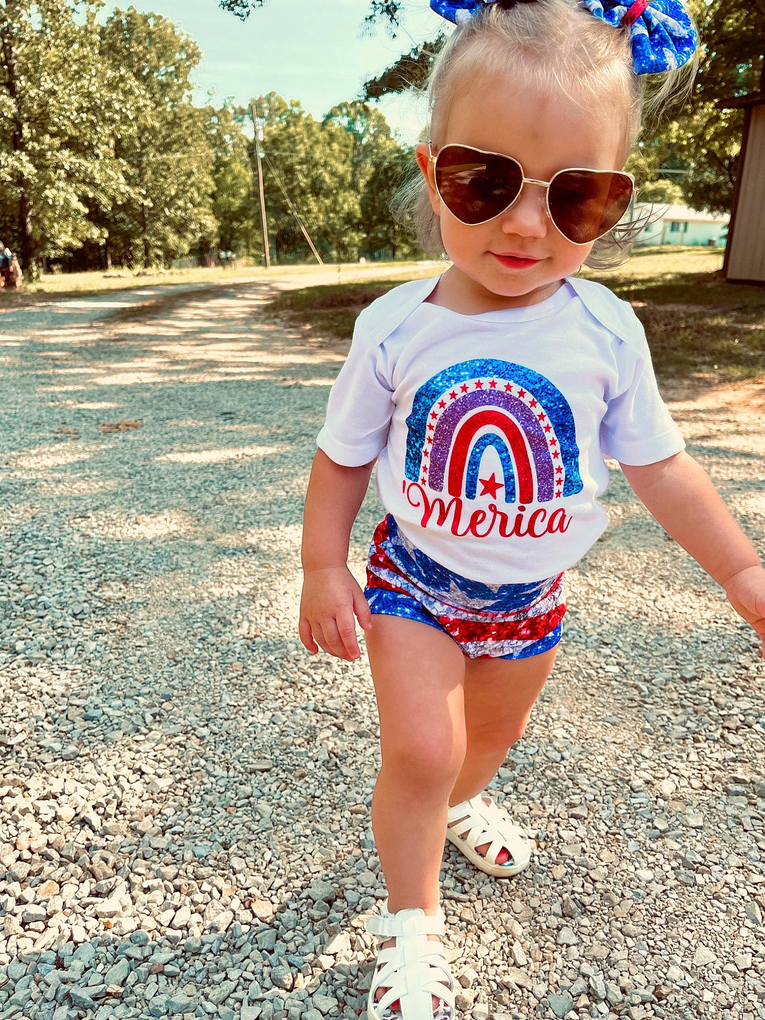 Aubrey is registered to the contest to win money with this photo: asphalt, baby_toddler_clothing, blue, child, cool, electric_blue, eyewear, fashion, fun, goggles, grass, hair, hairstyle, happy, person, sleeve, summer, sunglasses, t_shirt, toddler