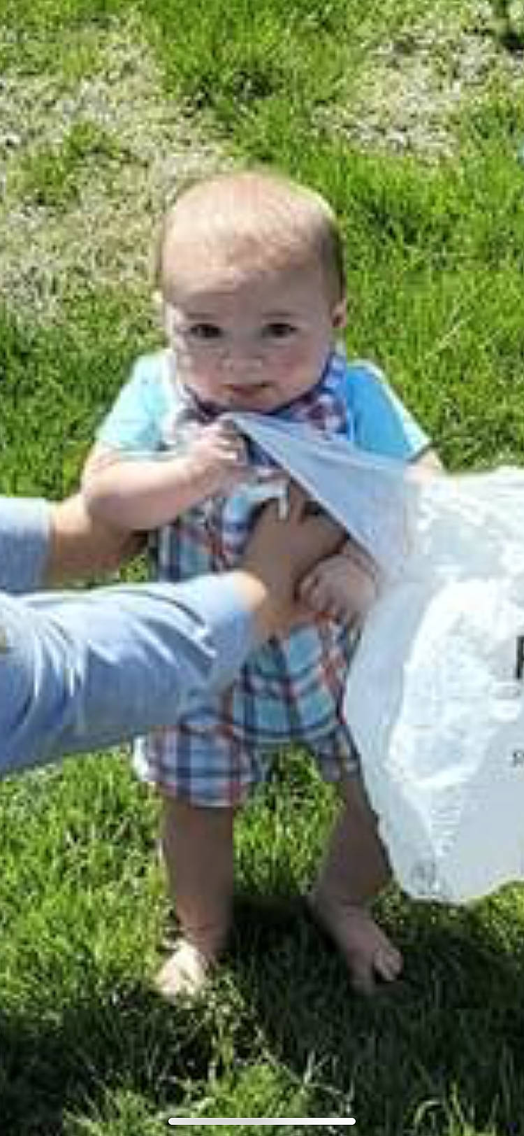 Oliver is registered to the contest to win money with this photo: baby, baby_toddler_clothing, child, foot, fun, garden, grass, happy, lawn, leisure, pattern, people_in_nature, person, plant, recreation, sharing, shorts, sitting, terrestrial_plant, thumb