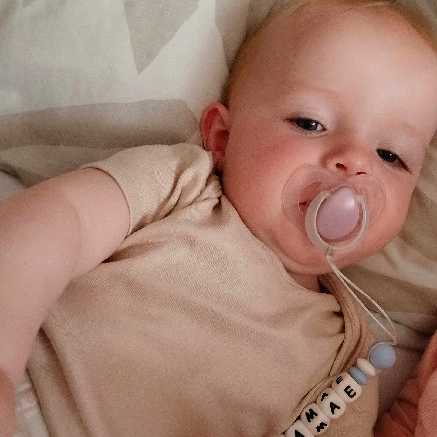 Amelia-Mae joined the competition — help win amazing prizes! accessories, baby, bed, biting, bodypart, clothing, couch, earring, face, finger, furniture, hand, head, jewelry, mouth, newborn, person, photography, portrait, t_shirt