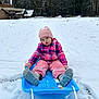 toddler, child, snow, sled, winter_clothing, pink_hat, pink_gloves, boots, snow_pants, jacket, outdoor, play, pouty_face, snowy_ground, trees, house, cold_weather, fun, winter, blue_sled
