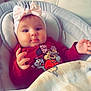 Cataleya a rejoint le concours — aidez-le/la à gagner de superbes lots ! baby, child, infant, headband, pink_bow, red_shirt, minnie_mouse, blanket, cushion, seat, indoor, cute, face, hands, portrait, comfort, soft, clothing, expression, young