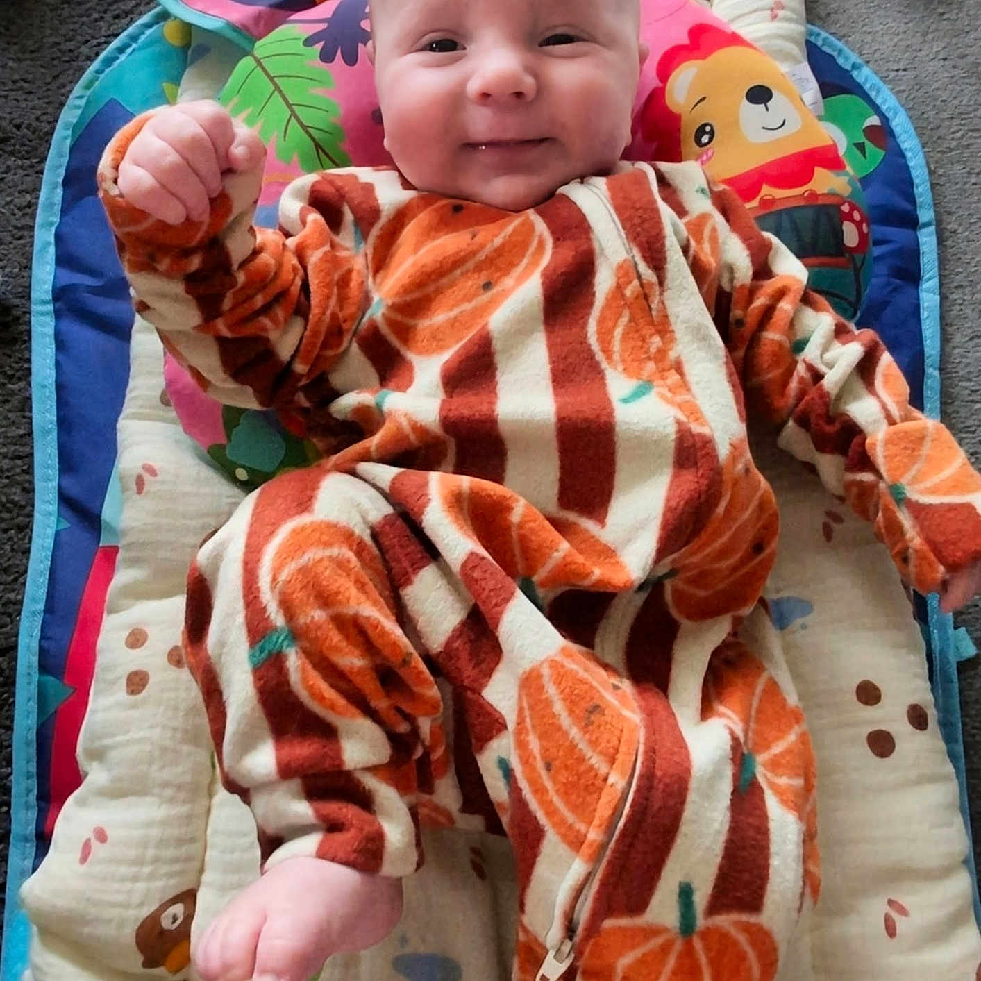 Jonyk joined the competition — help win amazing prizes! baby, child, colorful, cozy, cushioned_mat, cute, face, fist, floor, foot, happy, head, indoor, infant, lying_down, onesie, playmat, pumpkin_pattern, smiling, soft_texture