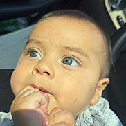 Asvel Navarrete joined the competition — help win amazing prizes! baby, child, face, hand, fist, blue_eyes, skin, clothing, car_interior, seat, sunlight, closeup, infant, cute, portrait, young_child, expression, human, skin_tone, sitting
