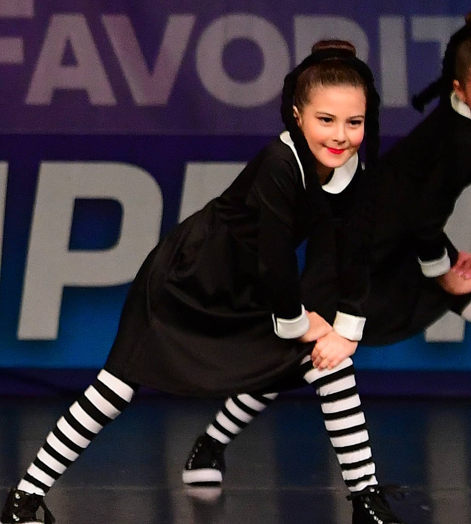 Jessalynn is registered to the contest to win money with this photo: boot, choreography, competition_event, entertainment, event, fashion_design, glove, hat, human_leg, joy, knee, performing_arts, person, player, recreation, smile, sneakers, sock, sports_uniform, sportswear