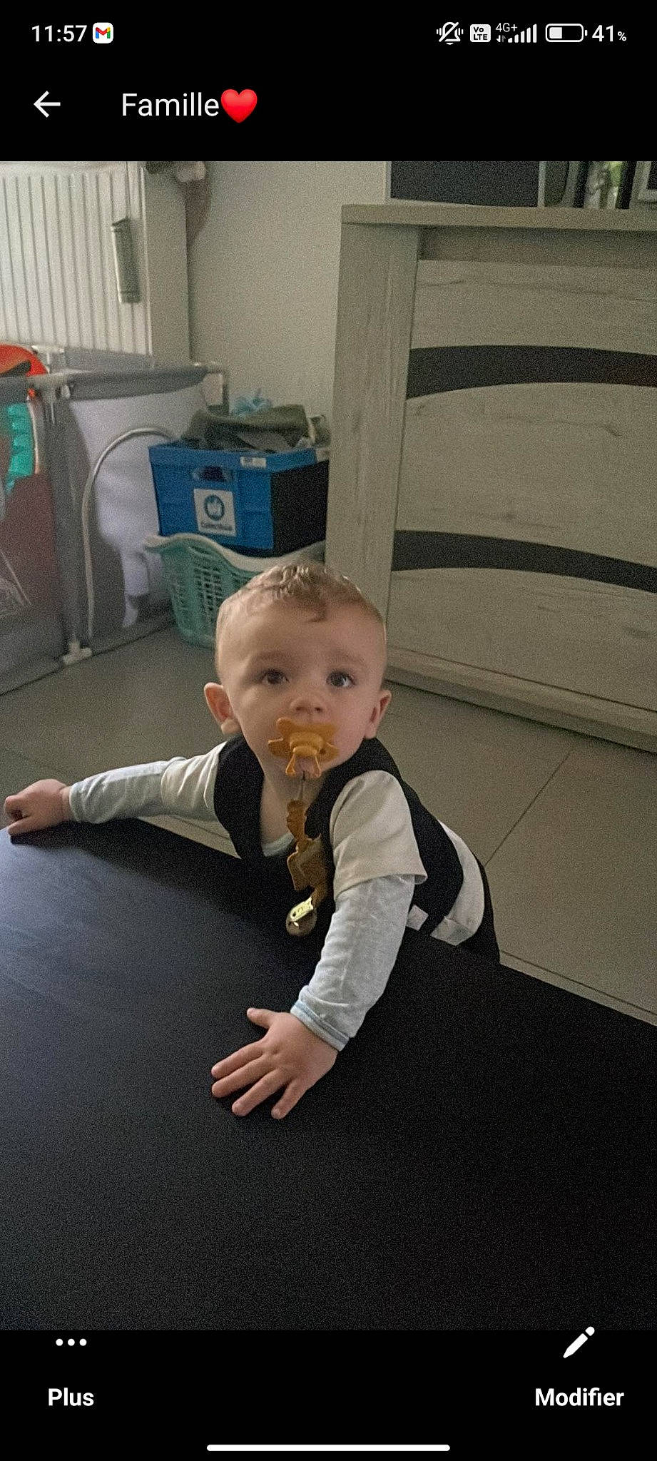 Ryan participe au concours pour gagner de l'argent avec cette photo : baby, baby_toddler_clothing, chair, child, comfort, floor, flooring, formal_wear, fun, hardwood, person, room, sitting, toddler, wood