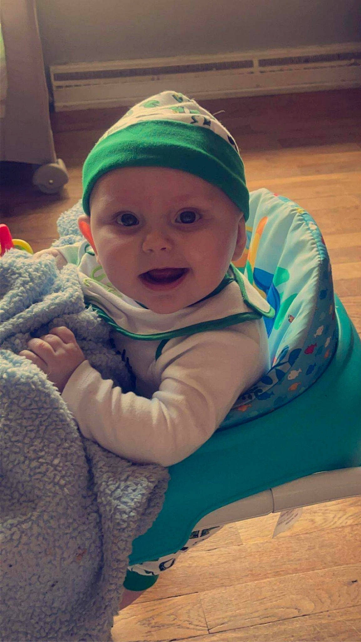 Sabrina is registered to the contest to win money with this photo: baby, baby_toddler_clothing, cap, cheek, child, comfort, electric_blue, eye, grass, happy, head, headgear, headwear, human_body, iris, mouth, nose, person, personal_protective_equipment, skin